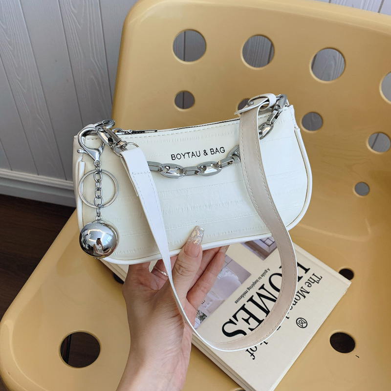 Bolso de brazo plateado de fuego para mujeres 2024 nuevo estilo de verano de lujo ligero nicho de alta calidad cadena bolso de mano para mujeres