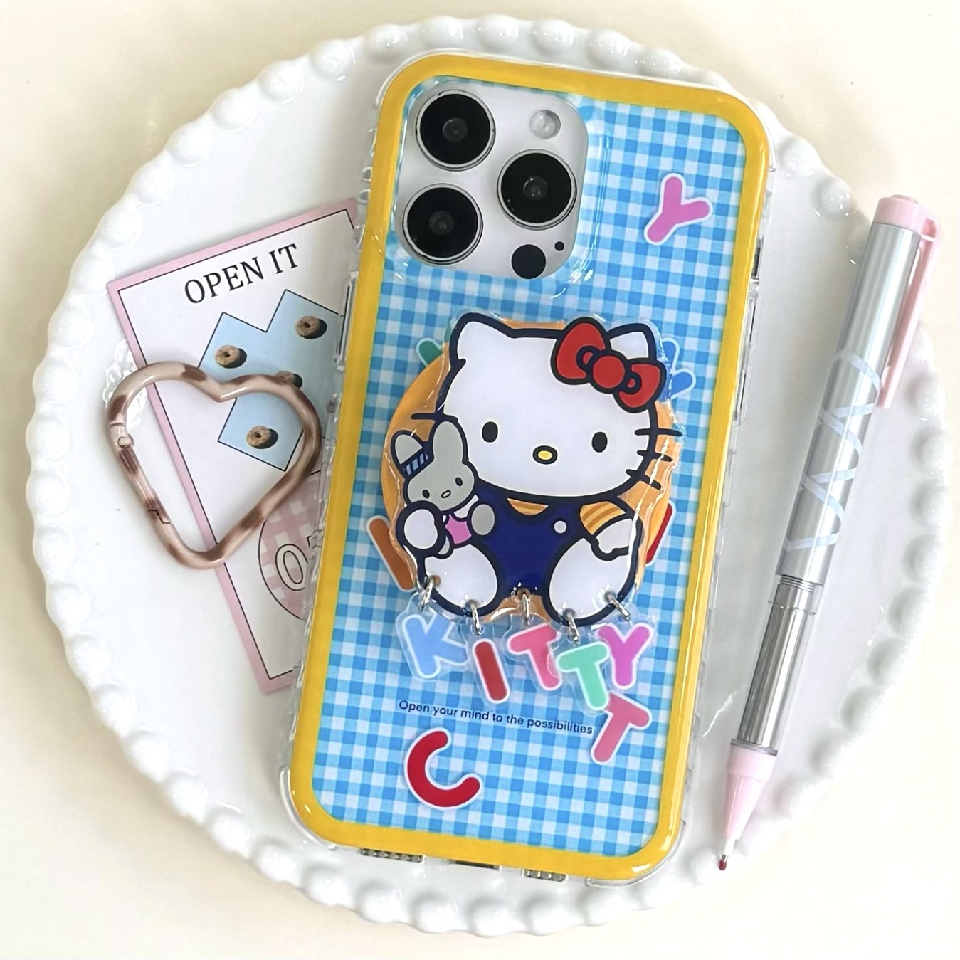 Lindo patrón de cuadros azul y amarillo Inglés KT gato para Apple 15ProMax funda para teléfono móvil 16Pro dibujos animados 14/13 nuevo 16