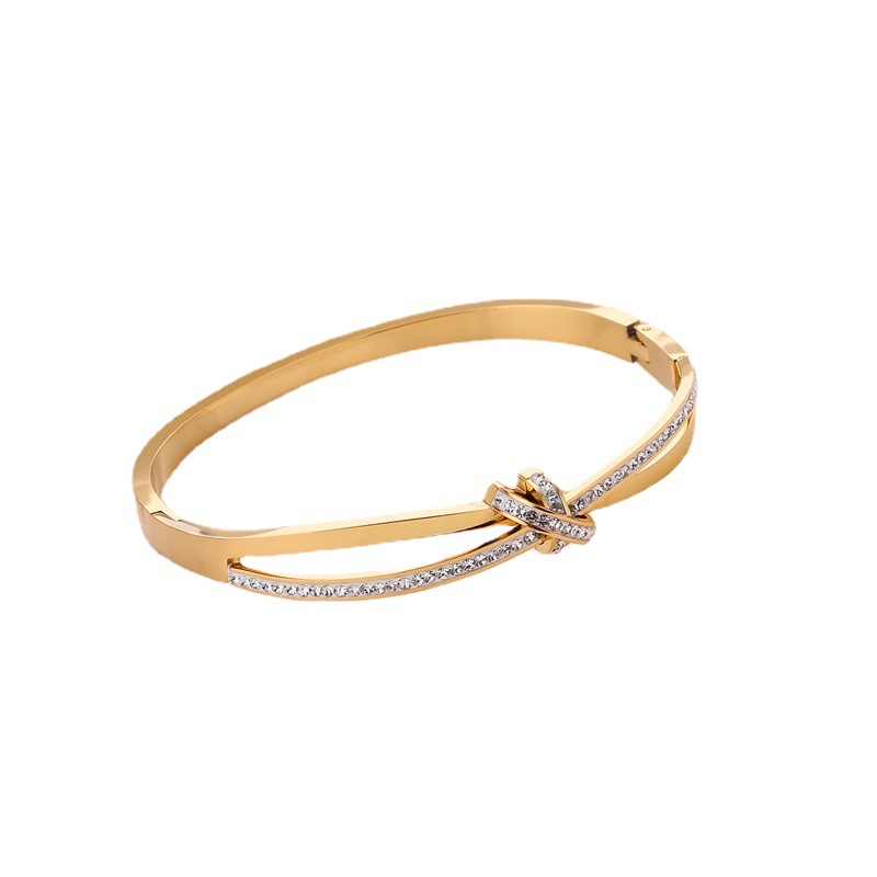 Europa y América de moda de acero inoxidable pulsera de nudo mujer amor rosa oro brillante abertura de botón fábrica de joyas al por mayor