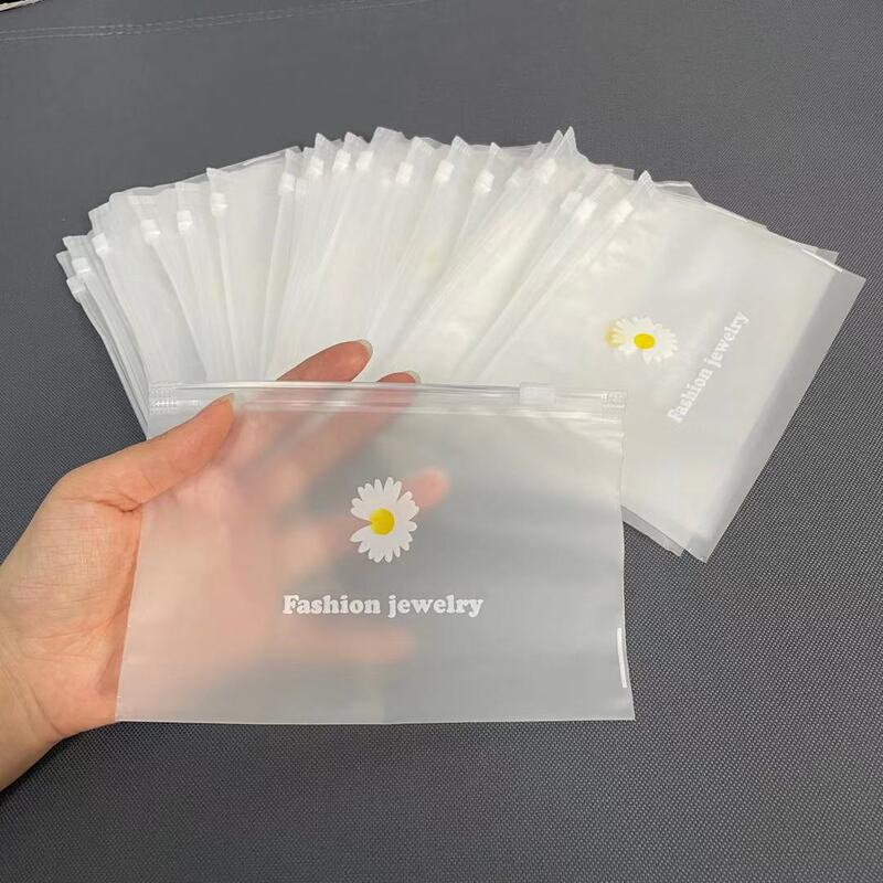 Daisy frosted zipper bag PE jewelry rubber band stationery transparent storage bag underwear socks packaging bag pull ring