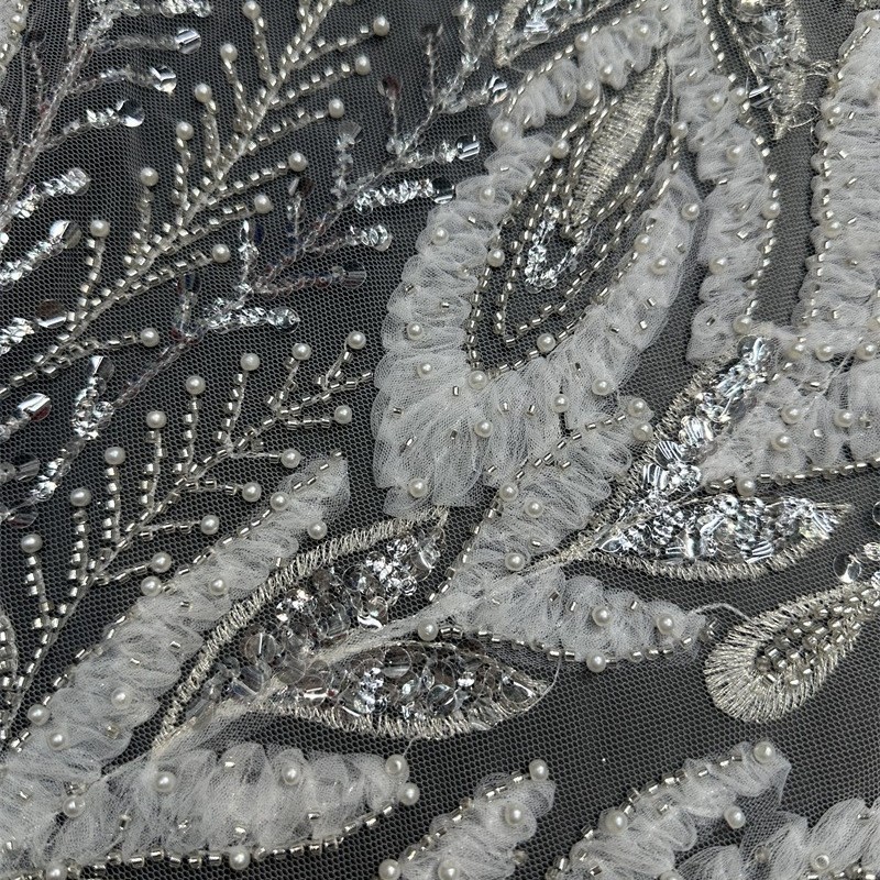 Tejido de tubo de perlas huecas tela bordada de tela de moda vestido de boda tela de encaje transfronterizo