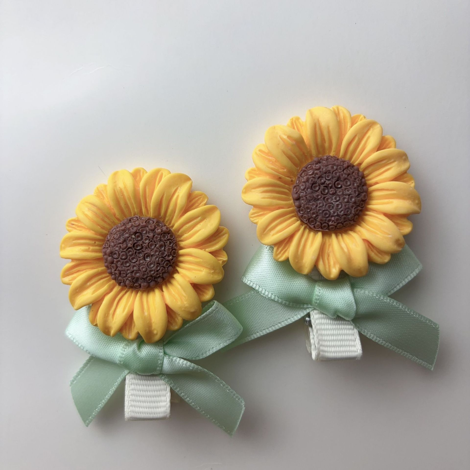 Fermaglio per capelli con fiocco e girasole stile foresta_voghion.com