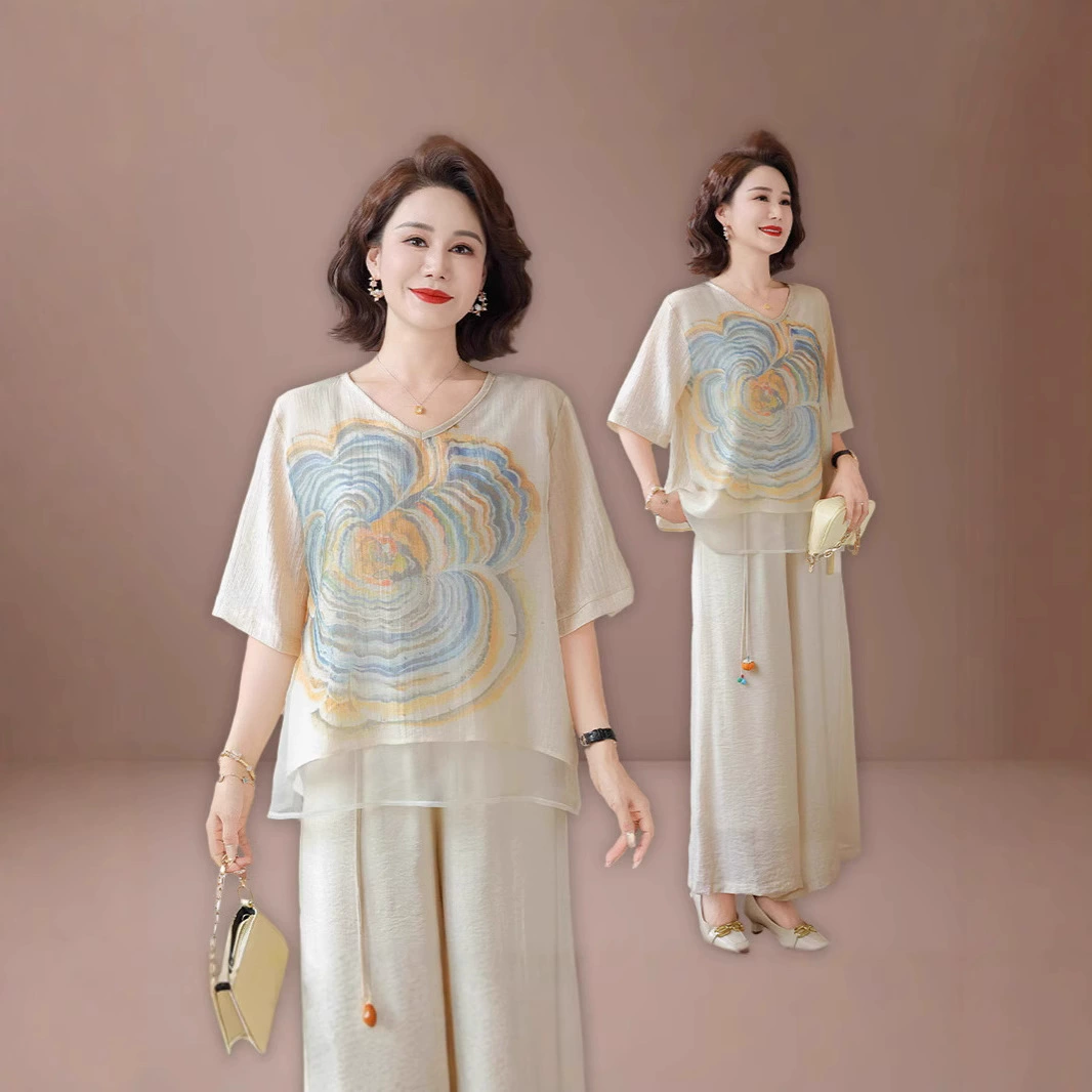 Элегантная и модная летняя рубашка из тенселя с короткими рукавами для женщин среднего возраста (50+), свободного кроя, стройнящая, рукава до локтя, изящная.