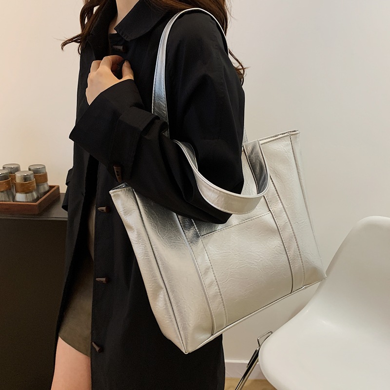 Bolsa de gran capacidad para mujeres 2024 nuevo estilo americano bolsas de compras de mano textura bolsas de hombro pu bolsas casuales simples