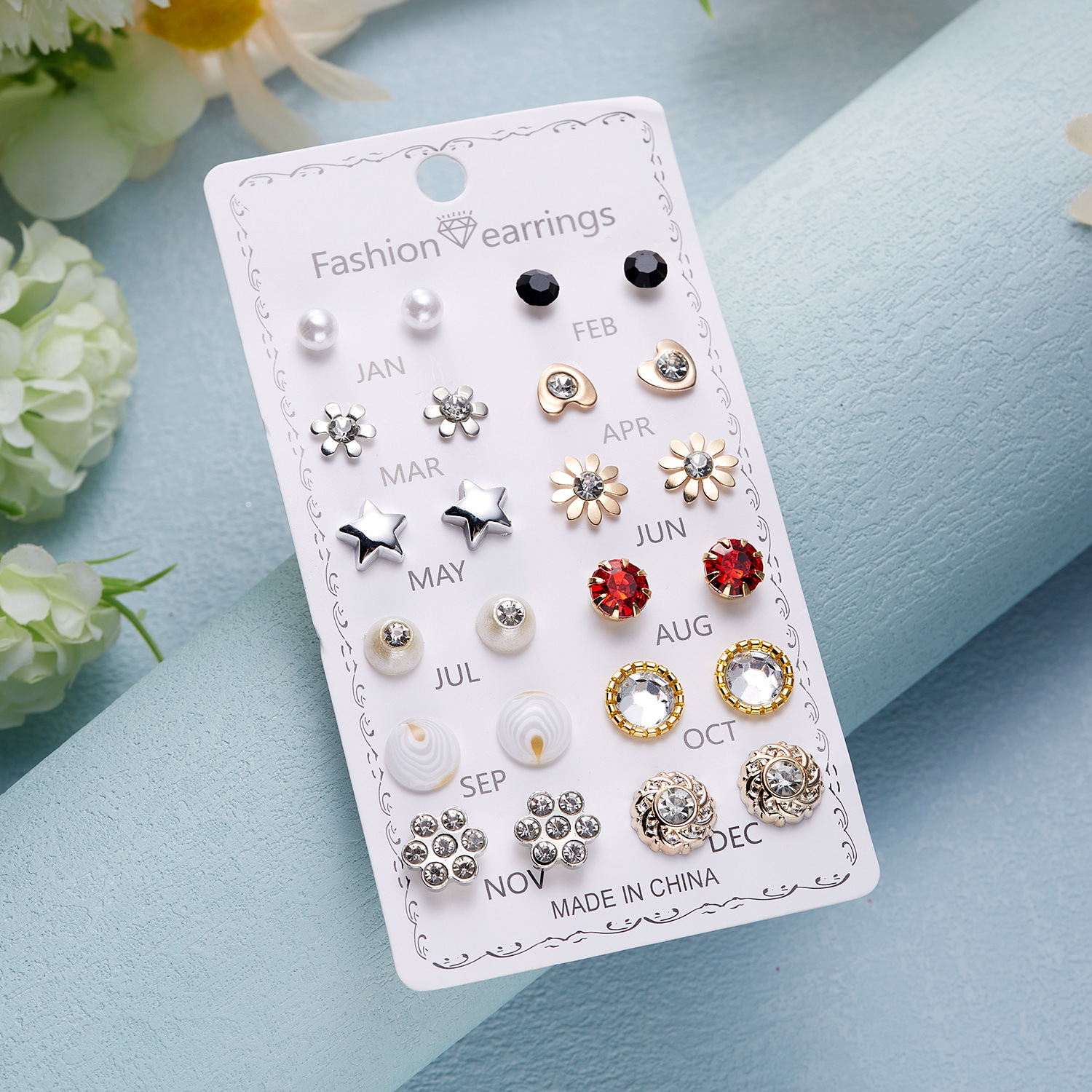 Set de aretes florales con perla y diamantes