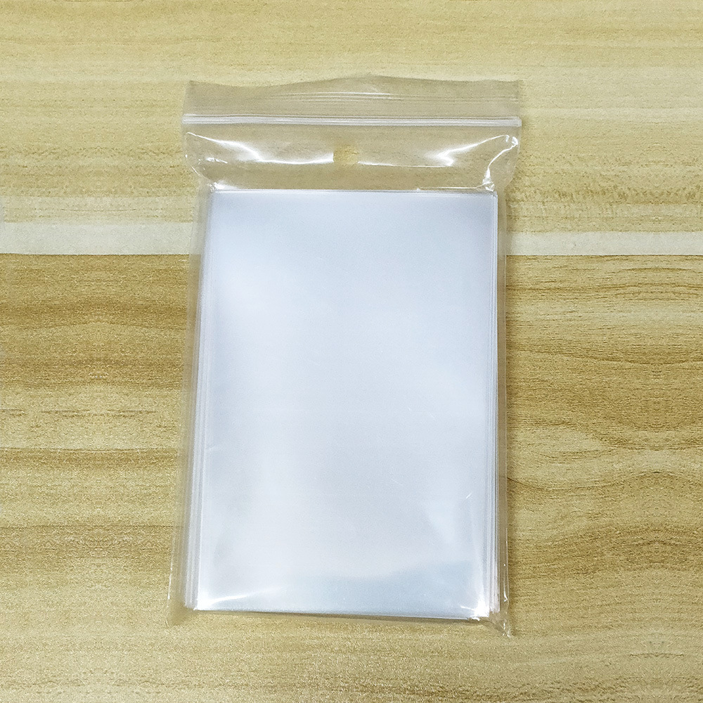 Venta al por mayor CPP transparente 20 tarjeta de seda película titular de la tarjeta gu ka tarjeta pequeña barra bolsa autoadhesiva bolsa de autosellado cubierta protectora palomitas de maíz