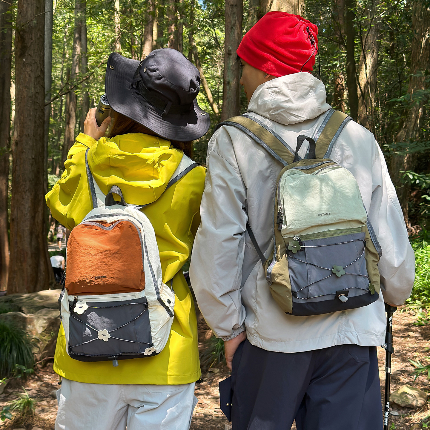 Viaje al aire libre mochila de mujer ligera colisión de color pareja mochila de montaña personalidad de cuerda cruzada mochila deportiva de fitness