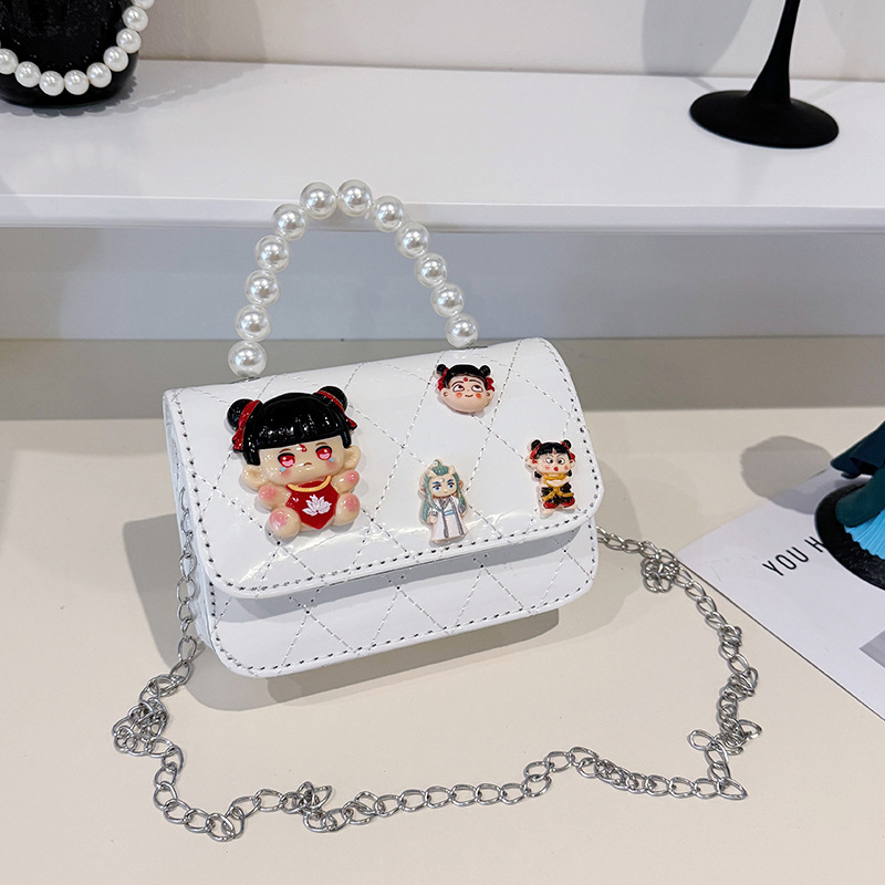 2025 nuevo niño pequeño viento mochila de hombro pequeña niña espejo princesa bolso de perla bolso de dibujos animados