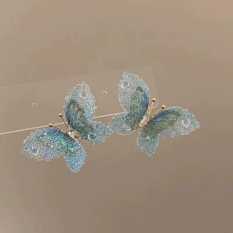 2026 viento falso sensación de atmósfera super inmortal pendientes de flores de malla temperamento suave de chiffon para mujeres pendientes