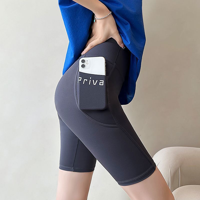 Verano delgado de cinco puntos pantalones de tiburón desgaste exterior de las mujeres bolsillo pantalones cortos vientre contracción cadera levantamiento Barbie polainas de las mujeres