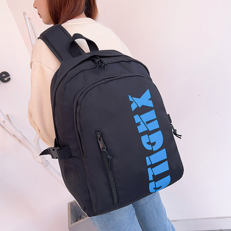 Mochila de moda de moda para hombres 2023 nueva mochila de hombro femenina de gran capacidad de letras de escuela secundaria mochila escolar