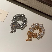 高级感珍珠蝴蝶结胸针高端高档小众胸花女时尚衣饰防走光扣别针女