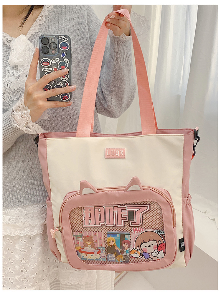 The new cute cartoon printed student bag with a large capacity and transparent student storage single-shoulder bag is selling well for women undefined