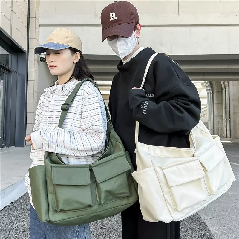 斜挎女包日系文艺洗水帆布包ins休闲时尚口袋邮差包复古单肩大包