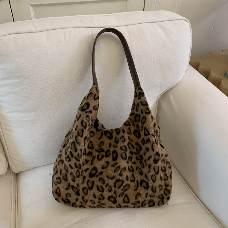 Corea del Sur estampado leopardo lazo viento bolso de brazo de viaje de mujer 2025 nuevo invierno bolso de hombro de tería