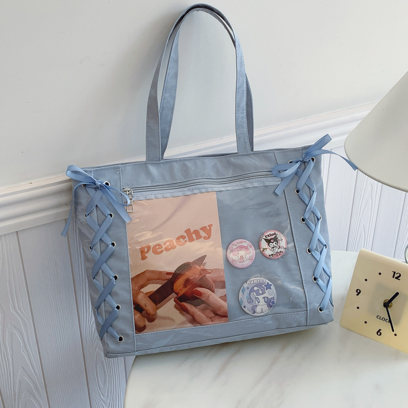 Bolsa de gran capacidad para mujeres dulces niñas de dos dimensiones transparentes 2025 primavera y verano pequeñas bolsas de hombro bajo la axila fresca