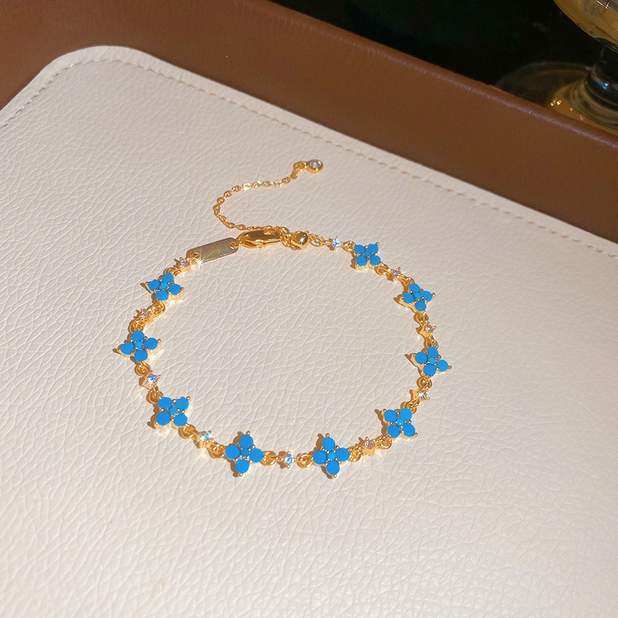 36 pulseras - doradas - azules