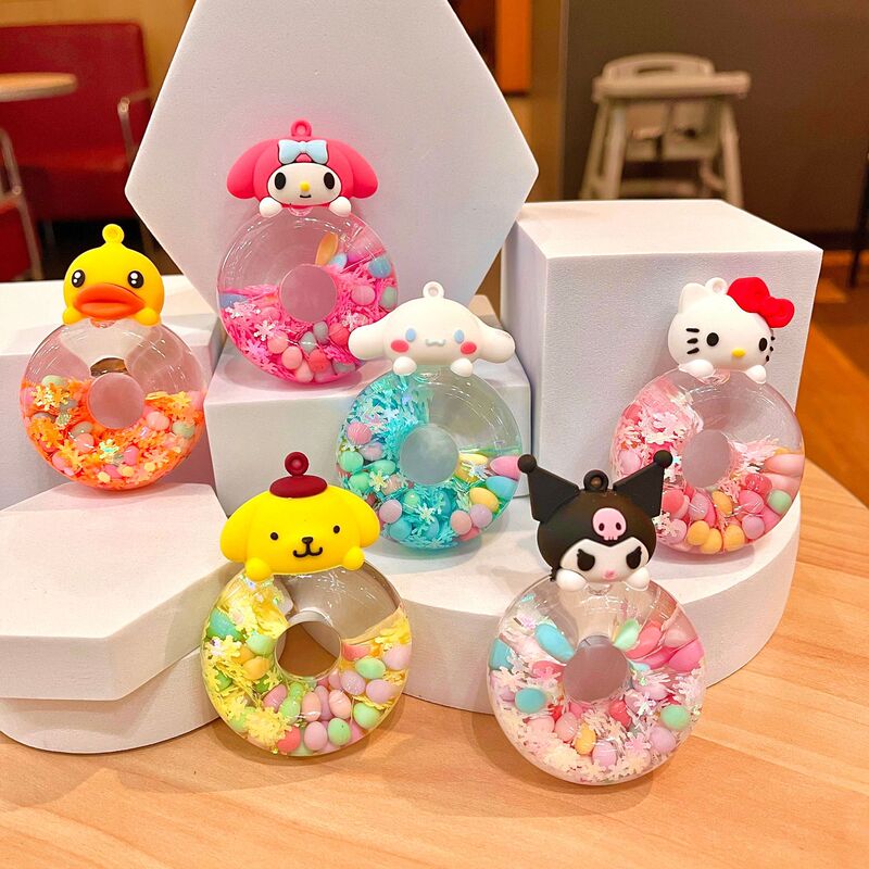 Online celebrity little yellow duck donut oil flowing sand bottle decoration Yugui dog keychain cartoon small pendant Accessories Wholesale
