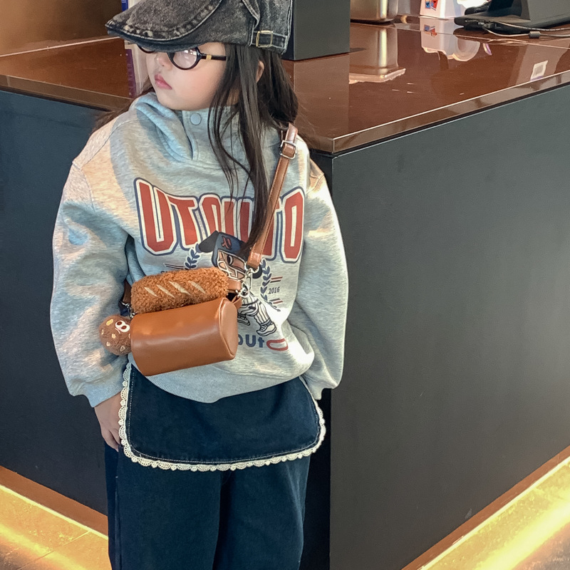 2025 otoño y invierno nuevo bolso infantil de moda coreana mini niñas bolso de peluche lindo colgante bolso cilíndrico
