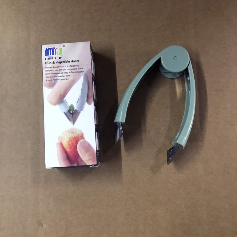 ティー除去器キッチンパイナップルは目を取ってキッチンツールを挟みます。|undefined