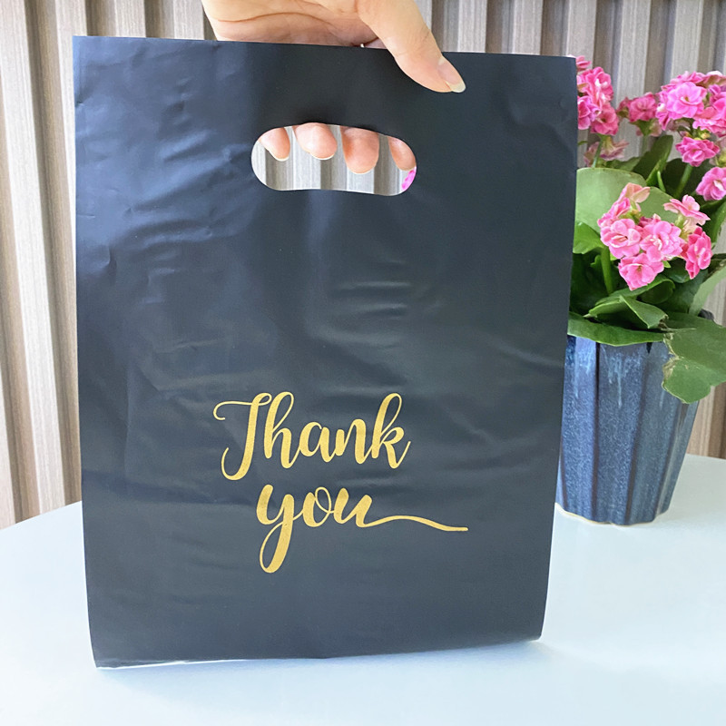 En stock bolsillo plano de cuatro dedos bolsa de plástico portátil Negro Bolsa de ropa bolsa de embalaje de regalo de espesor medio transfronterizo al por mayor