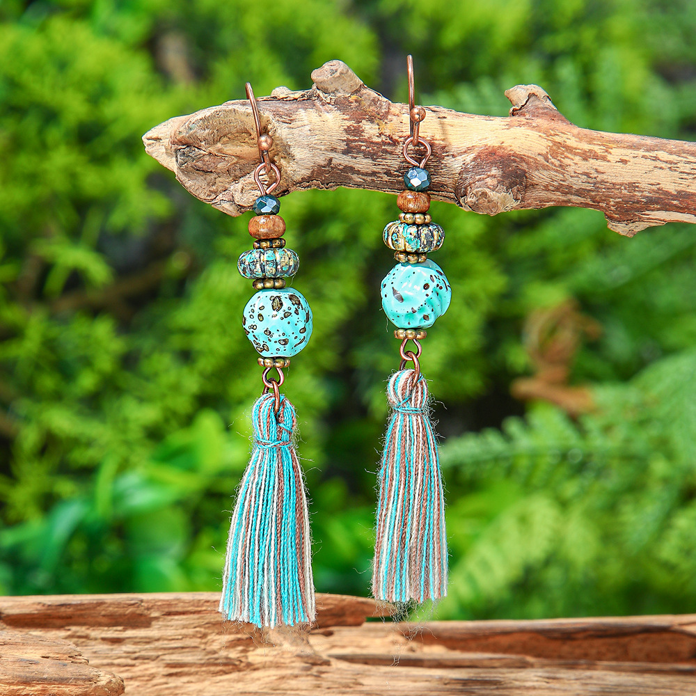New vintage leaf pendant earrings women's fashion hollow carved alloy tassel earrings European and American fashion jewelry batch