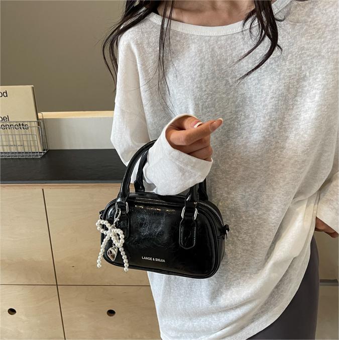 Bolso de mano de alta textura versátil verano 2024 nuevo bolso de mujer estilo extranjero versátil bolso de hombro bolso de viaje
