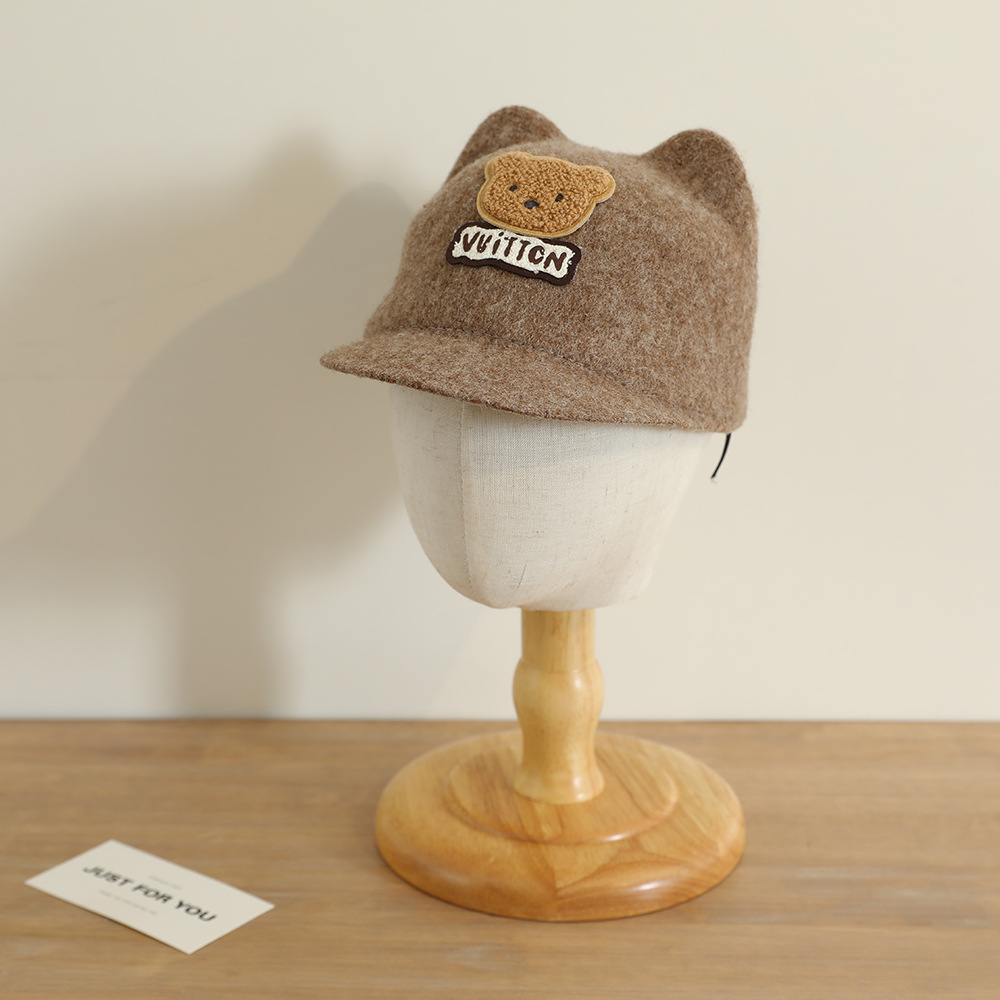 La nueva gorra de orejas de oso lindo y súper lindo niño coreano bebé masculino y femenino otoño e invierno cálido sombrero de copa de lana