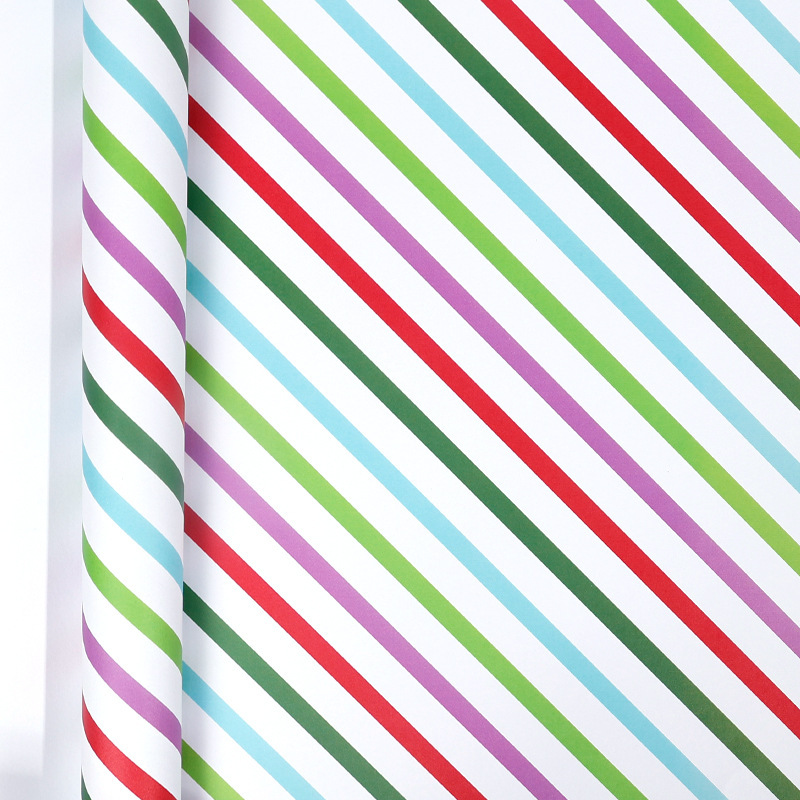Papel de regalo navideño clásico y popular de gran tamaño con diseño de dibujos animados y temática navideña para envolver regalos.