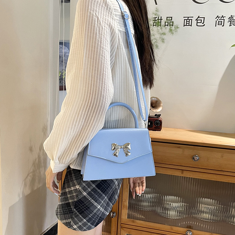 Arco de moda de verano 2025 hermoso nuevo estilo ocio de estilo extranjero suave portátil de hombro mochila pequeña bolsa de mujer