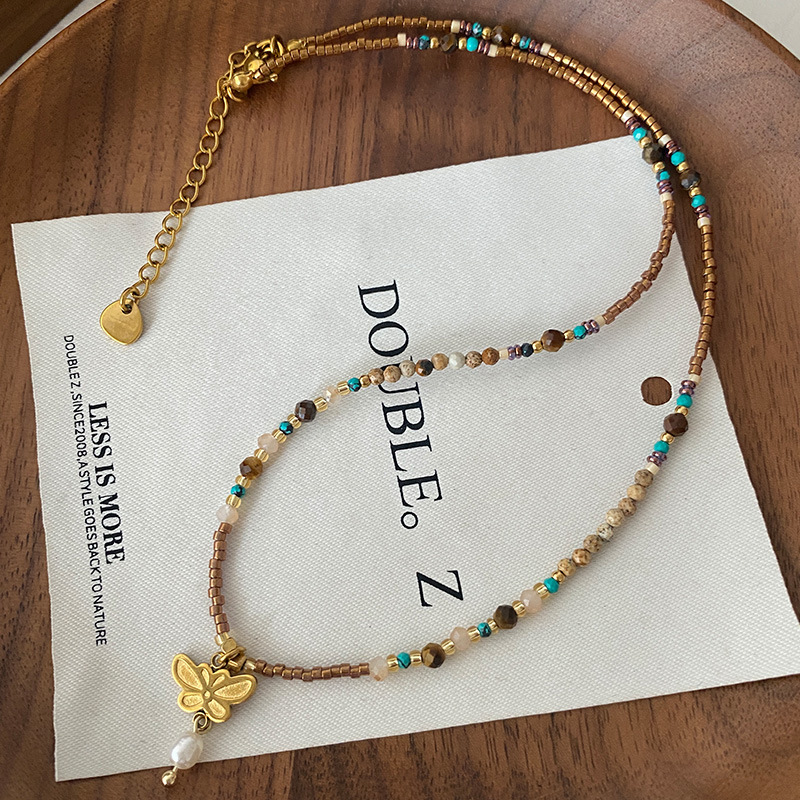 Collar con cuentas de ojo de tigre Maillard Cadena de suéter de otoño e invierno de alta calidad Acero de titanio Cadena de clavícula de piedra natural retro de lujo ligero