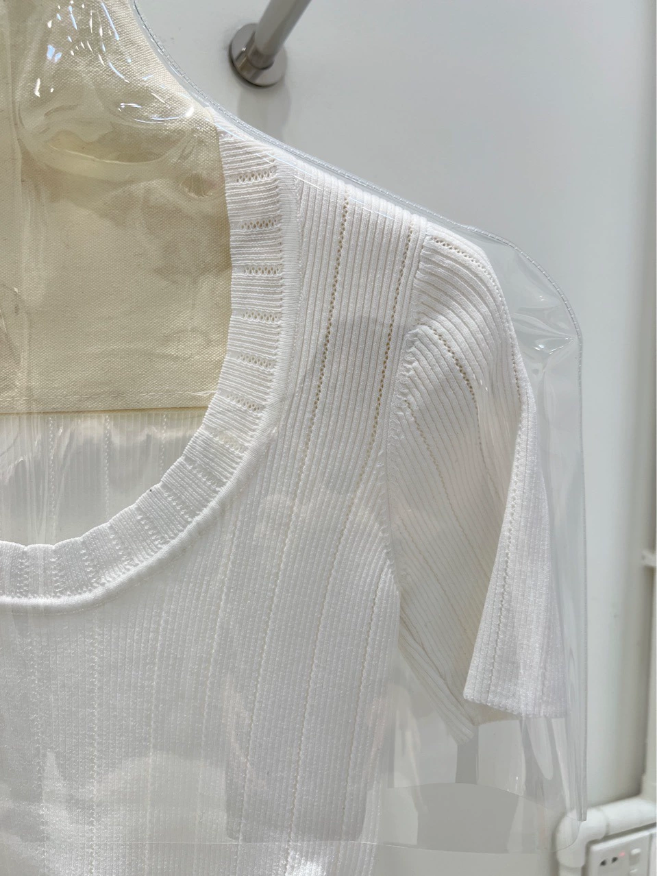 Quality white sweater with a round collar, with short sleeve