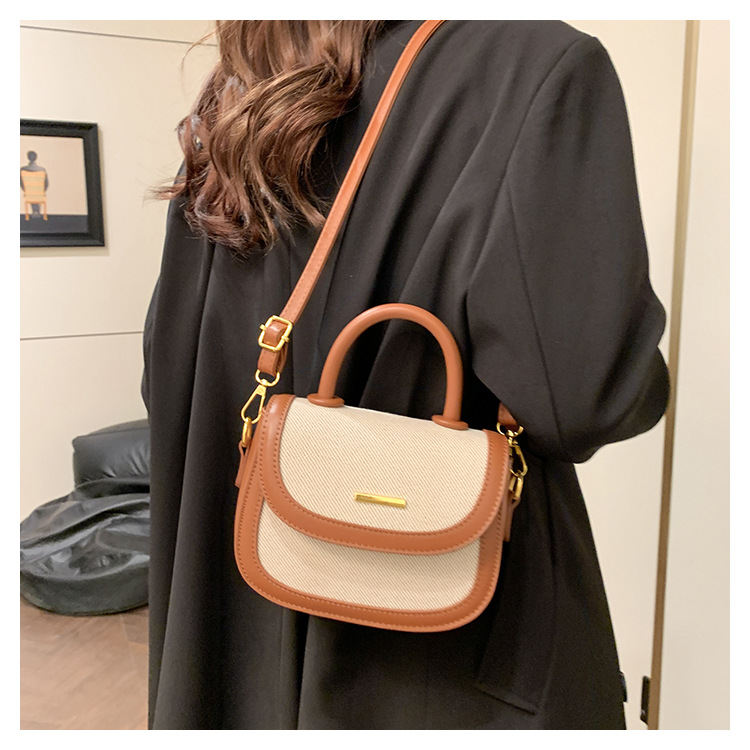 Bolsos de silla de mano de alta textura para mujeres 2026 nueva moda transfronteriza retro color contrastante empalme mochila de hombro