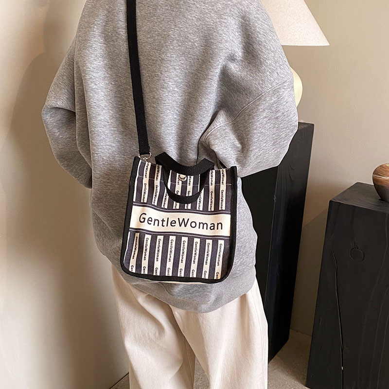 Moda rayas bolsa de lona para mujeres 2023 nueva carta impresión portátil bolsa de compras bolso de hombro al por mayor