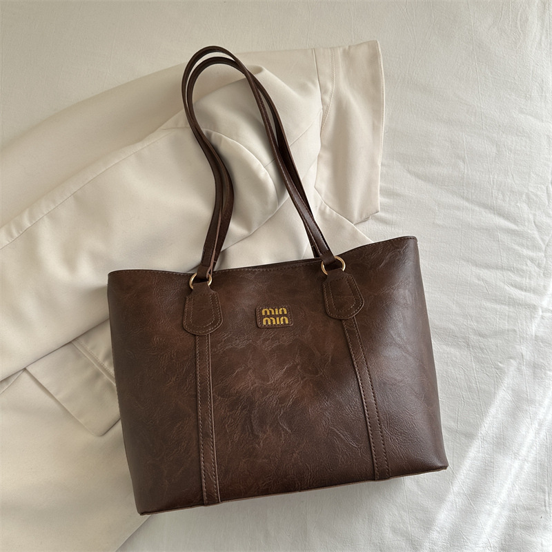 Bolsa de hombro de viaje retro de alto nivel, mujer, invierno 2024, nueva bolsa de mujer de trabajo, moda de bolsas Toto este año.