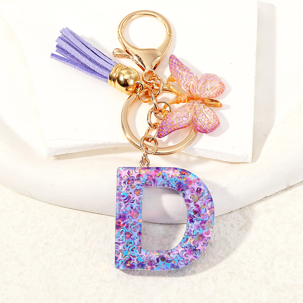 Mayorista transfronterizo mariposa esquinilla iniciales llavero de cristal goteo llavero de letras bolsos colgante