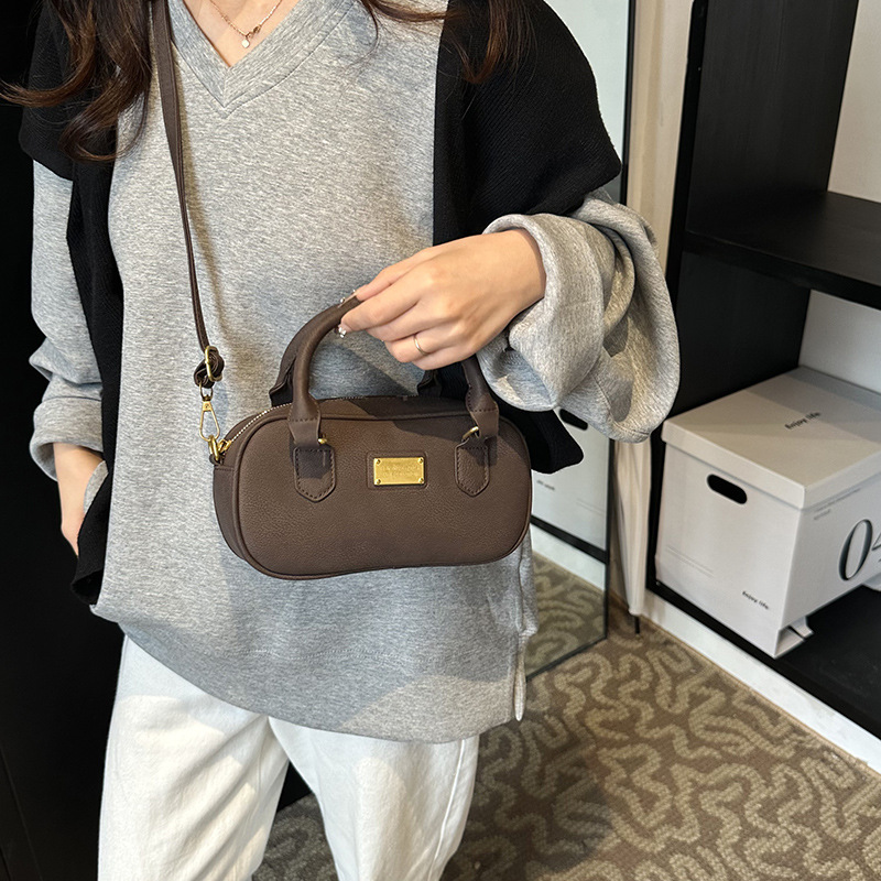 Bolso de bolos de mano de moda 2024 nuevo bolso de mujer retro simple bolso de hombro de alta calidad bolso de mochila universal mujer