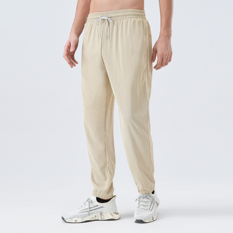 Pantalones deportivos de tejido para hombres respirantes absorbientes de humedad secado rápido entrenamiento de maratón de atletismo para correr pantalones casuales