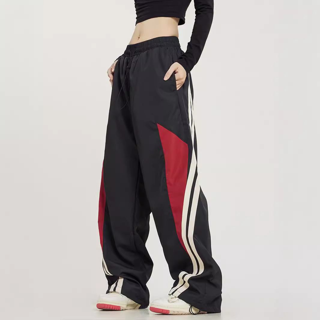 Pantalones deportivos a juego con rayas laterales de baile callejero retro americano para hombres y mujeres pantalones anchos sueltos rectos de primavera y otoño