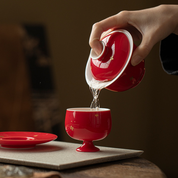 Red festive ceramic tea cup for home use