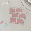 A frame of pink and white fish cake slices