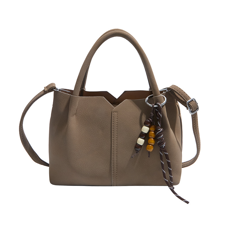 Bolso de mano de alta sensación de moda bolso de balde de mujer 2025 invierno retro simple bolso de hombro temperamento mochila de viaje