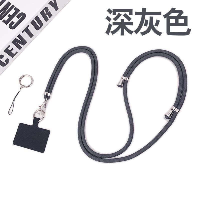 携帯電話のストラップの首が斜めにまたがっています。|undefined