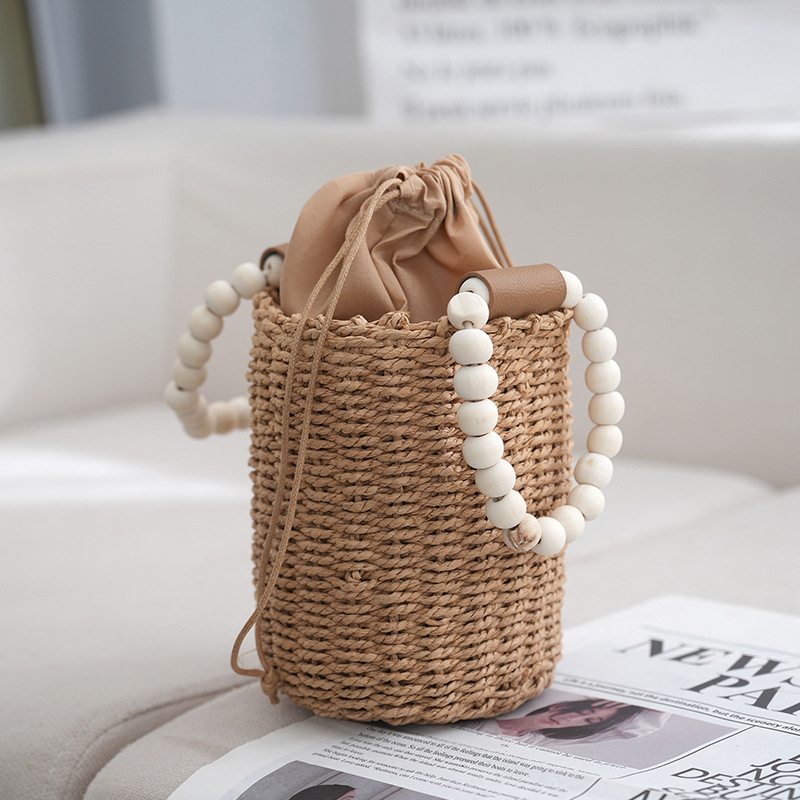 수제 밀짚 가방 실린더 휴대용 동전 지갑 밀짚 가방 진주 손잡이 실린더 핸드백 봄 새로운 스타일