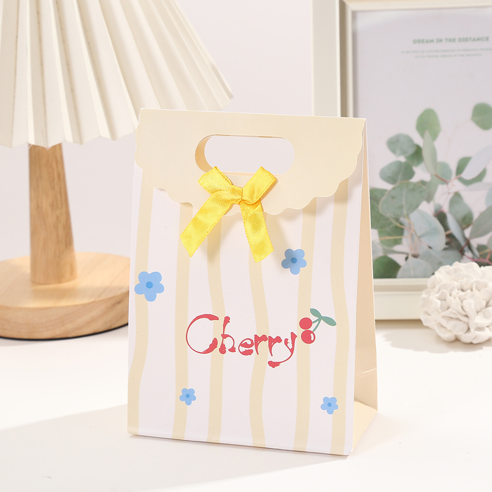 Bolsa de regalo de arco rayado de dibujos animados bolsa de embalaje de postre impresión en color Flip bolso de cartón blanco bolso