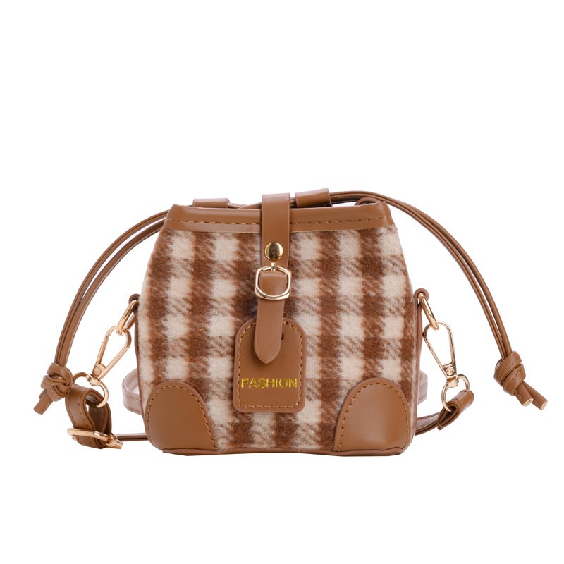 2025 nuevo bolso infantil de moda coreana estampado leopardo para niños y niñas bolso de cubo de aire a placas extranjeras bolso de cambio de bebé