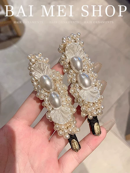 One pair of heavy-duty pearl hairpins