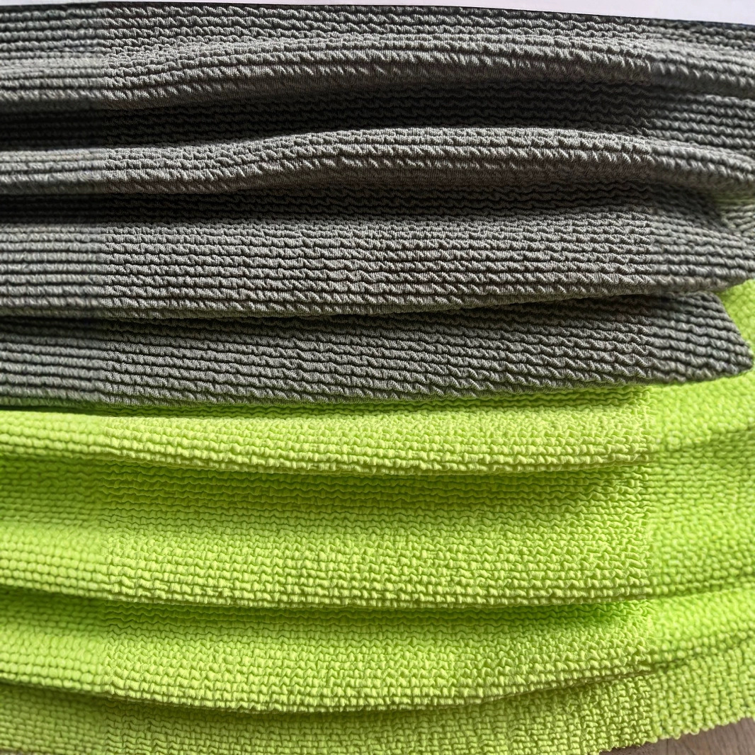 涤氨坑条提花针织面料皱皱弹力布运动泳装柔软亲肤泳衣比基尼面料