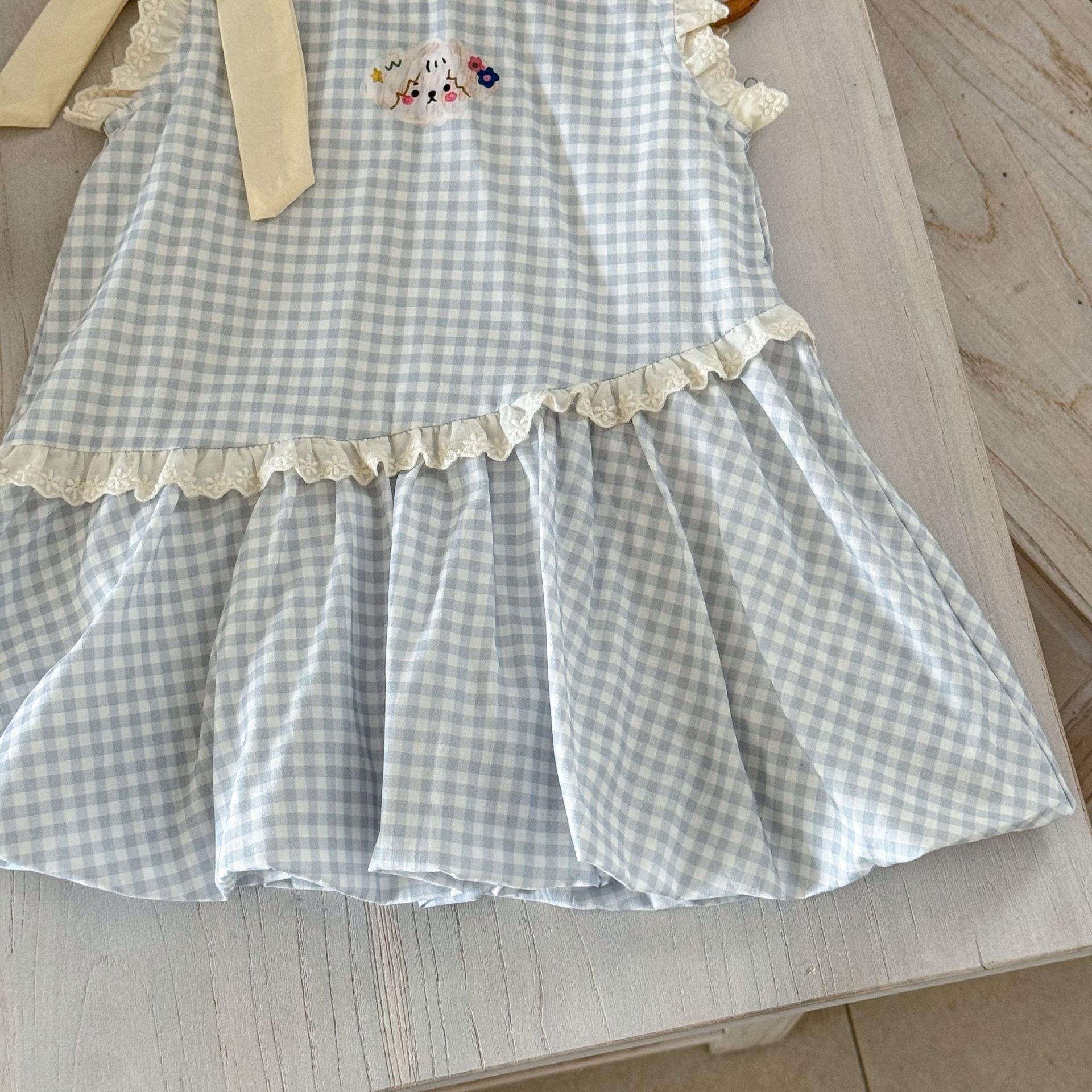 Vestido de siete niñas de limón salado verano versión coreana de dulce lazo azul a cuadros bebé lindo chaleco de capullo de flor falda de moda
