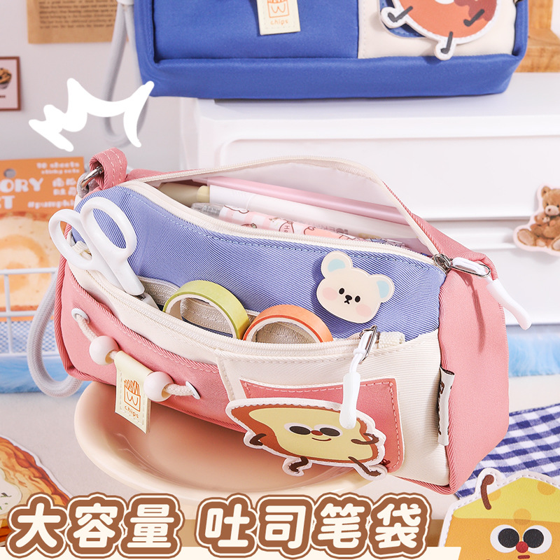 Nuevo estuche para lápices de gran capacidad para estudiantes, bolsa de papelería de nicho, caja de papelería con sentido de diseño portátil, caja de lápices multicapa de color en contraste de dibujos animados